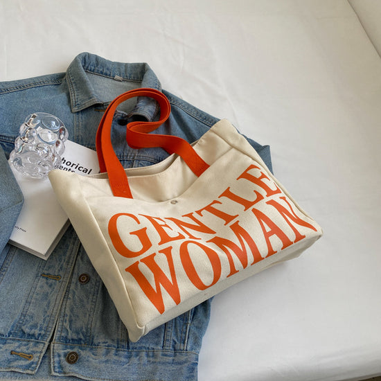 Large Letter Printed Canvas Shoulder Bag orange color Prints & Handle