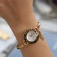 Phoebe Quartz Black Bezel, White Dial, Golden Stainless Steel Ladies Bangle